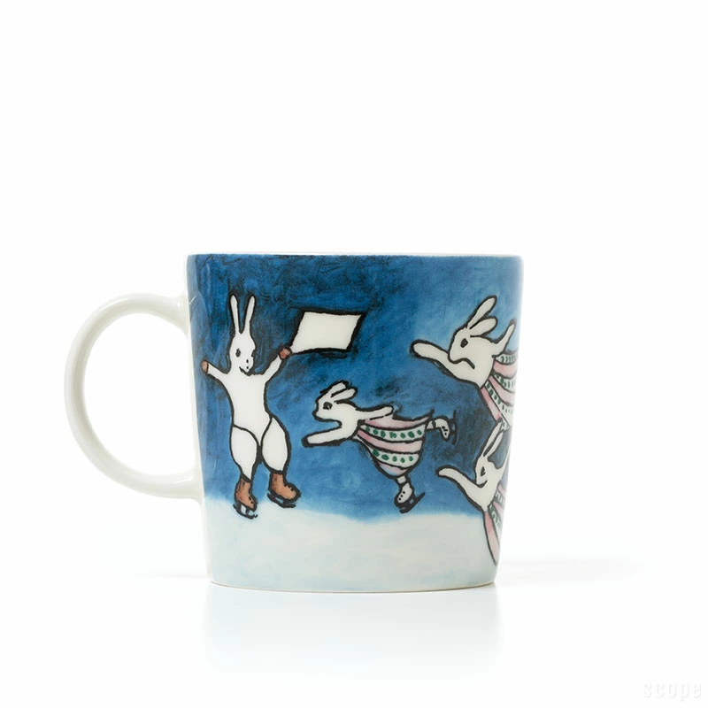 Arabia Heljä Rabbit Hooray mug 2024 featuring rabbits skating in a winter landscape