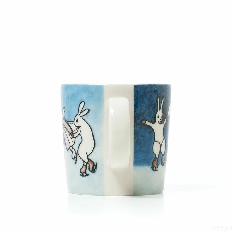 Arabia Heljä Rabbit Hooray mug 2024 featuring rabbits skating in a winter landscape