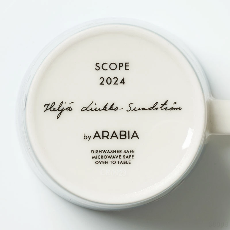 Arabia Heljä Rabbit Hooray mug 2024 featuring rabbits skating in a winter landscape